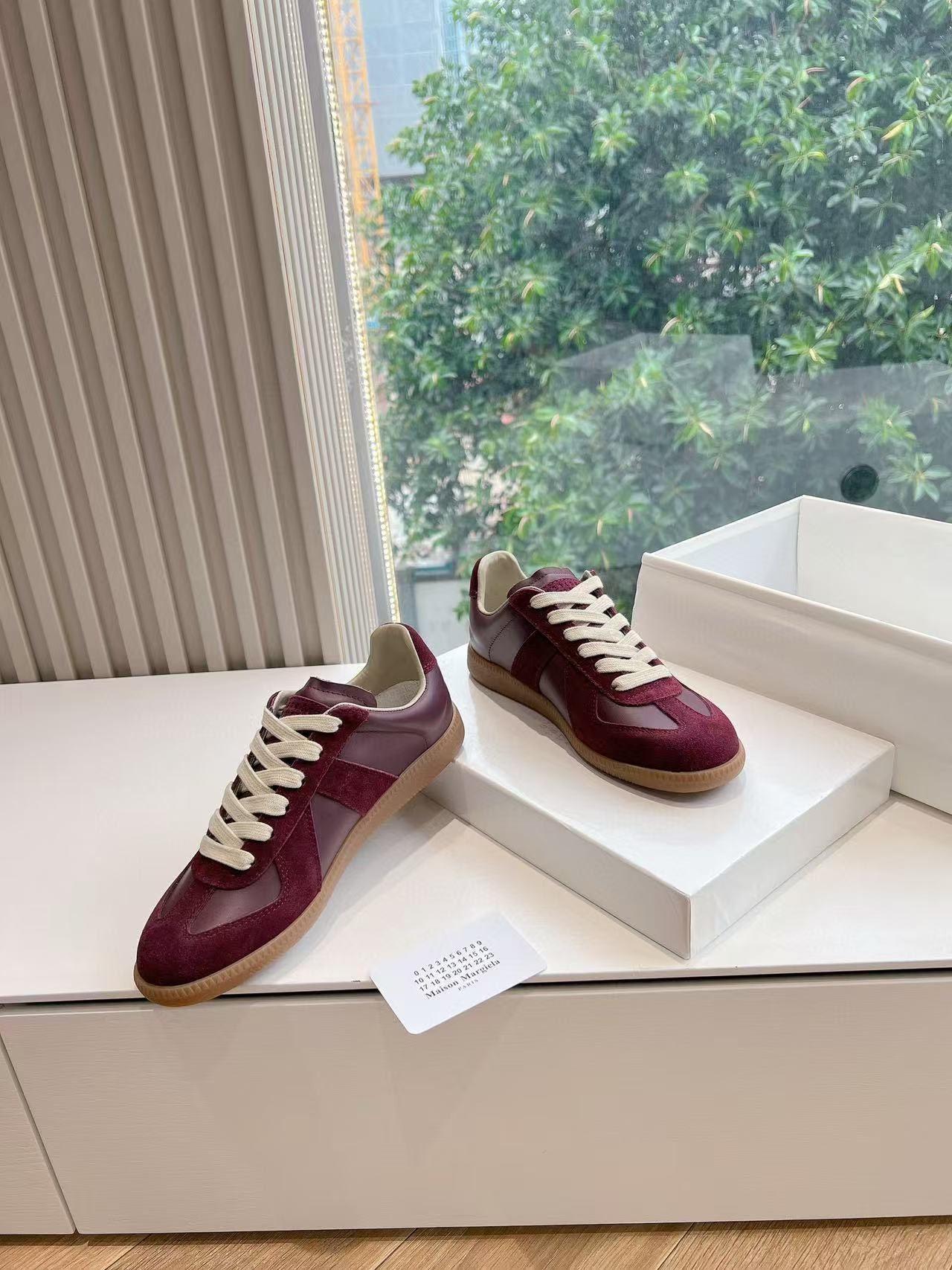 ua ma*s*n Ma*i*la mm6 sneakers