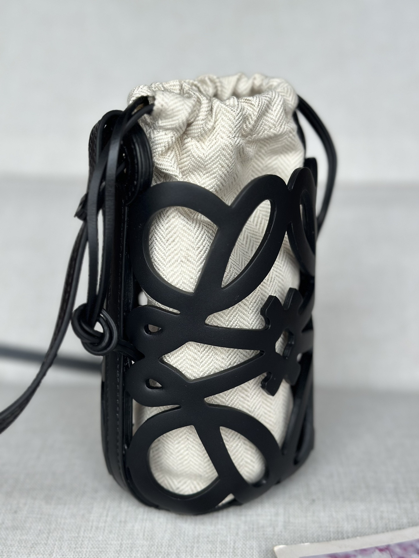 L0ew* anagram cut-out pocket in classic calfskin and canvas 20x11x8cm